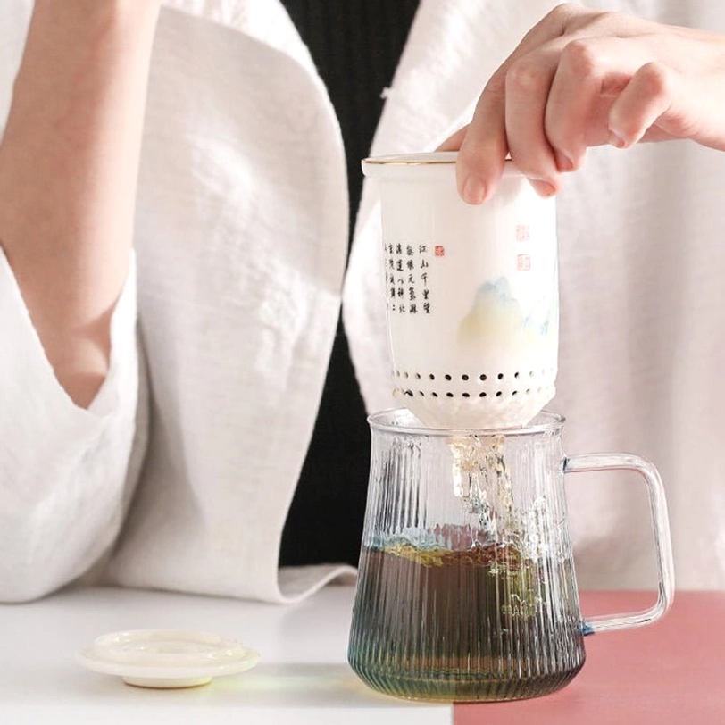 blue gradient glass tea infuser mug used in home and office tea making
