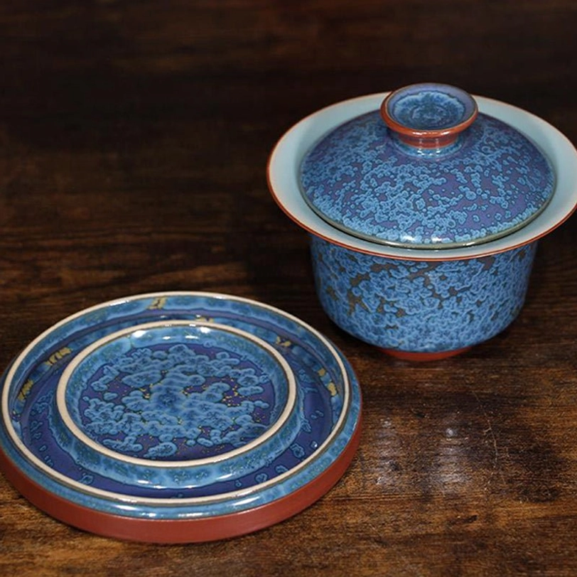 close up of unique kiln glaze pattern on blue jun kiln gaiwan