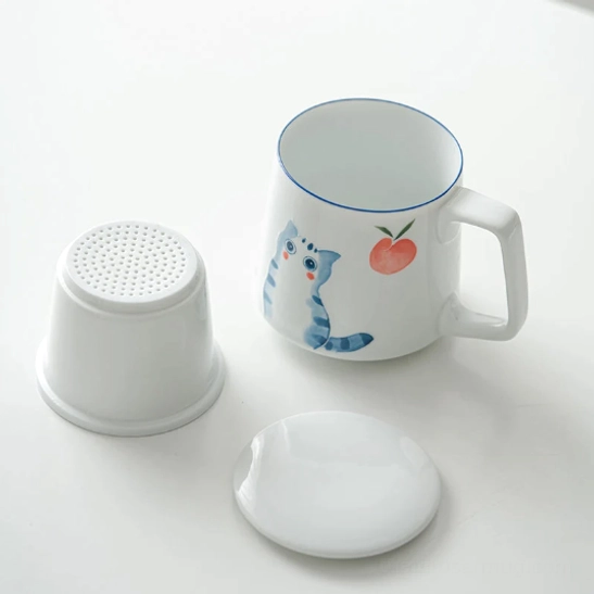 blue rim detail of the cat peach ceramic tea infuser mug