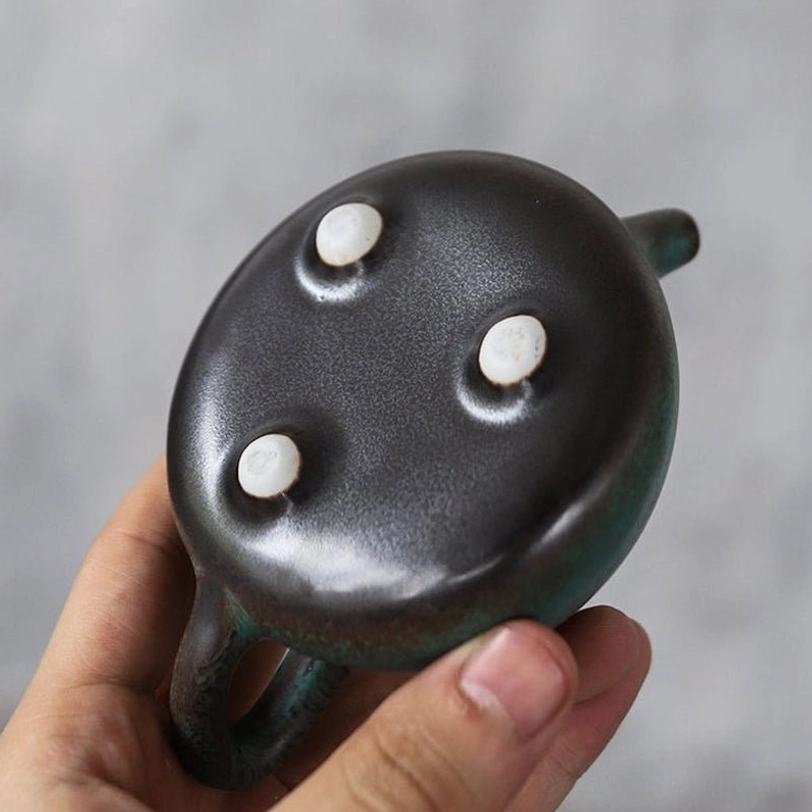 bottom view of 125ml ceramic teapot showing anti-slip feet