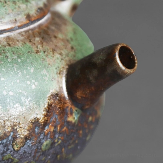 Bottom view of retro green ceramic Kyusu side handle teapot
