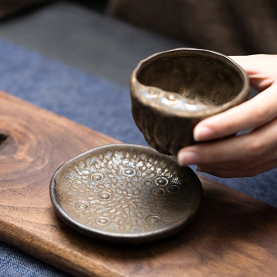 bottom view of matching saucer for lotus ceramic teapot