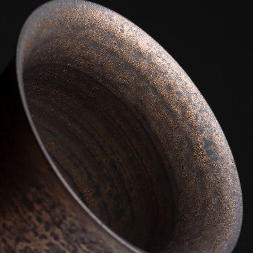 Close up of lid and rim on antique bronze Chinese gaiwan tea cup