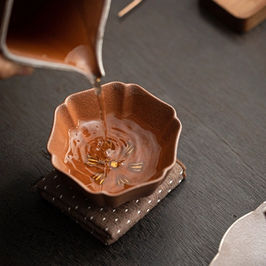 profile side view of brown textured japanese clay tea cup