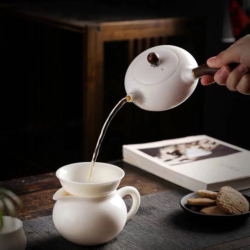 close-up of built-in ceramic infuser inside kyusu teapot for filtering loose leaf tea