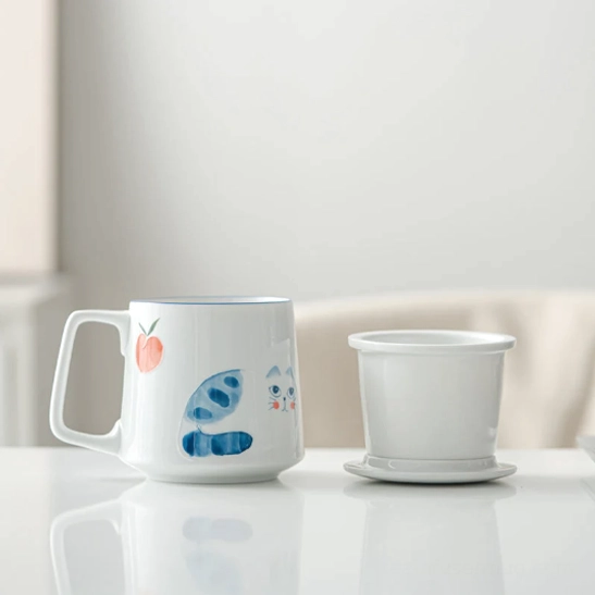 side view of cat printed ceramic tea infuser mug with matching lid