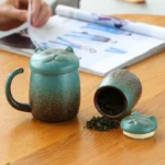 full set of cat-shaped ceramic tea infuser mug and matching cat tea canister