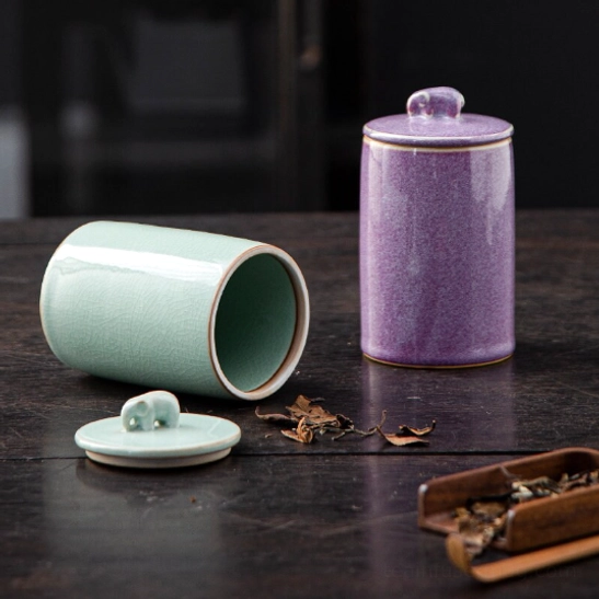 Elephant handle ceramic tea canister displayed on living room shelf