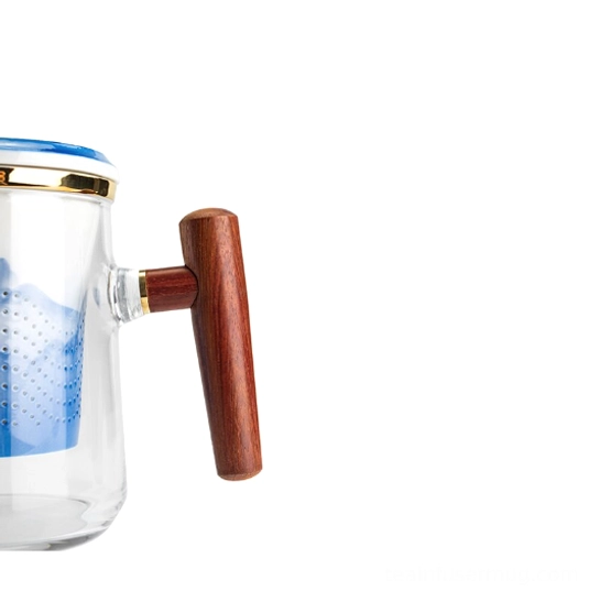 close up of fine filter holes on the ceramic tea infuser for the glass mug