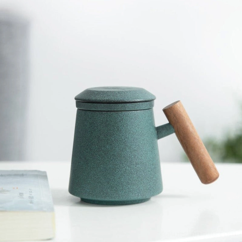 bottom view of ceramic tea infuser mug with wooden handle