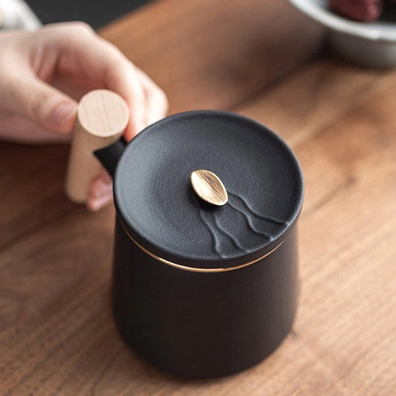 ceramic tea infuser mug disassembled showing lid infuser and cup