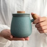 ceramic tea infuser mug with wooden handle and infuser basket