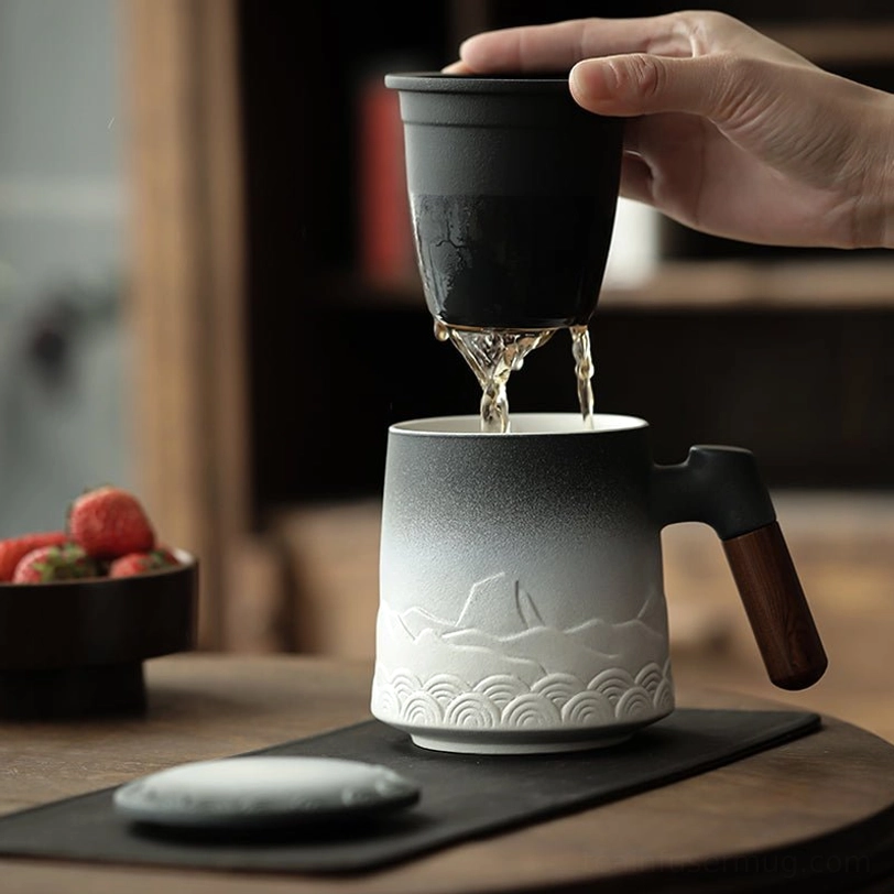 side view of ceramic tea infuser mug showing natural heat-resistant wood handle