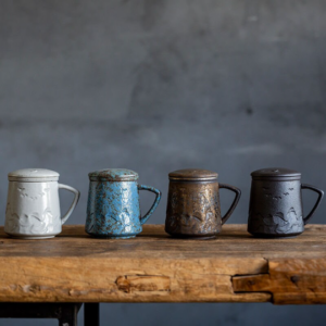 full set of ceramic tea mug with infuser and lid showing all color options
