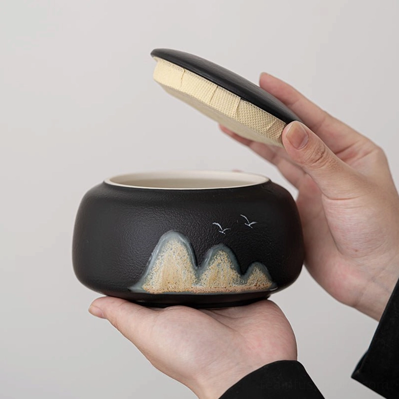 side view of sealed ceramic tea storage canister