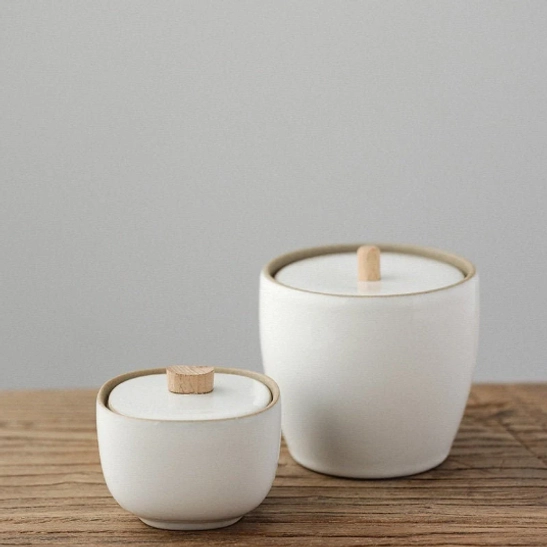 white ceramic airtight tea storage jar with natural wood handle