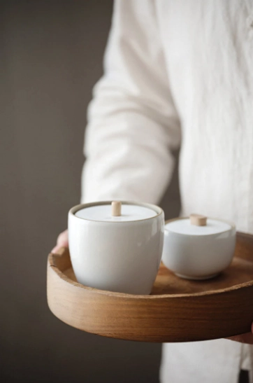 ceramic tea storage jar styled with traditional tea setup