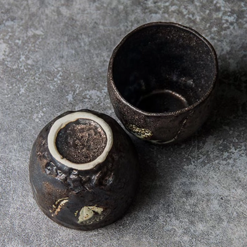 Close up of the base of a Chinese lotus clay tea cup