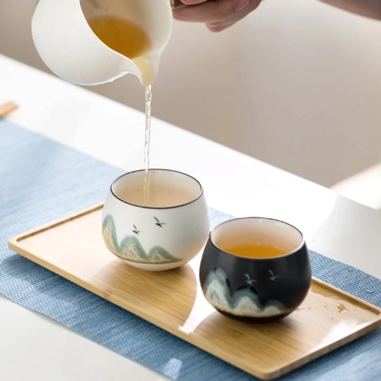chinese mountain tea cup on wooden tea table