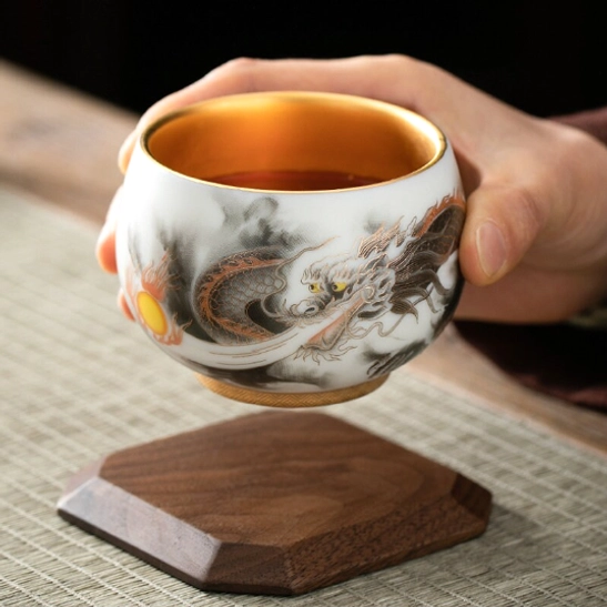 Top view of Chinese phoenix tea cup showing golden fu character at inner bottom