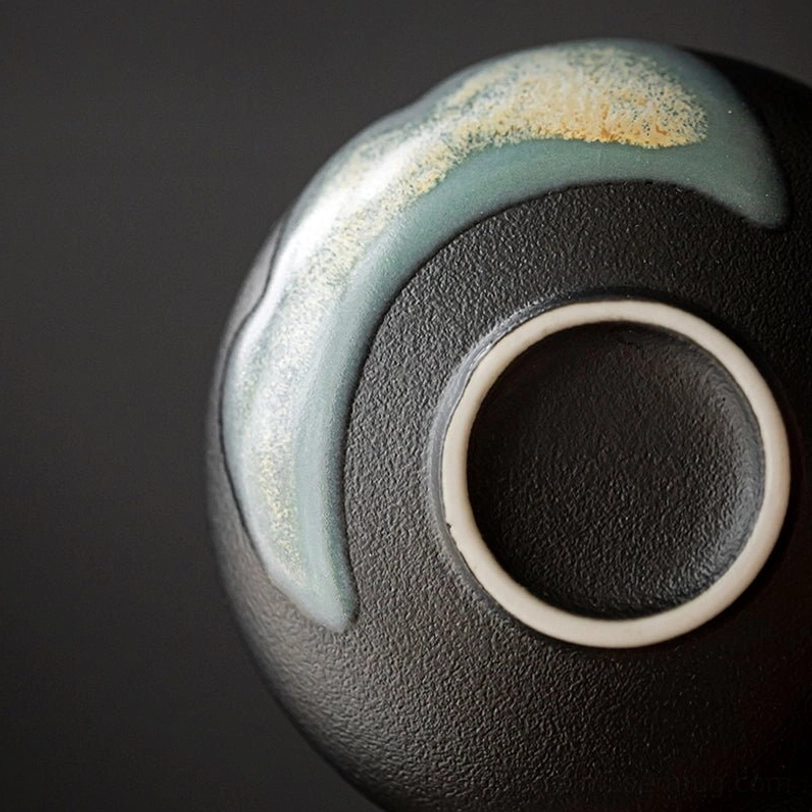 base of black ceramic chinese tea cup showing finished craftsmanship