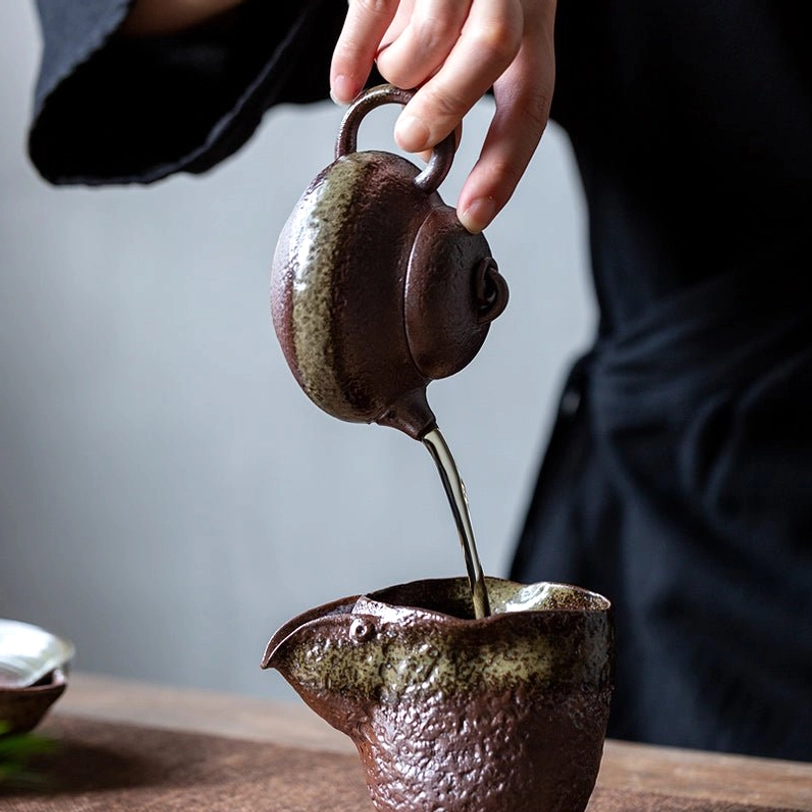 side view of 150ml compact Chinese teapot with infuser showing accent glaze band