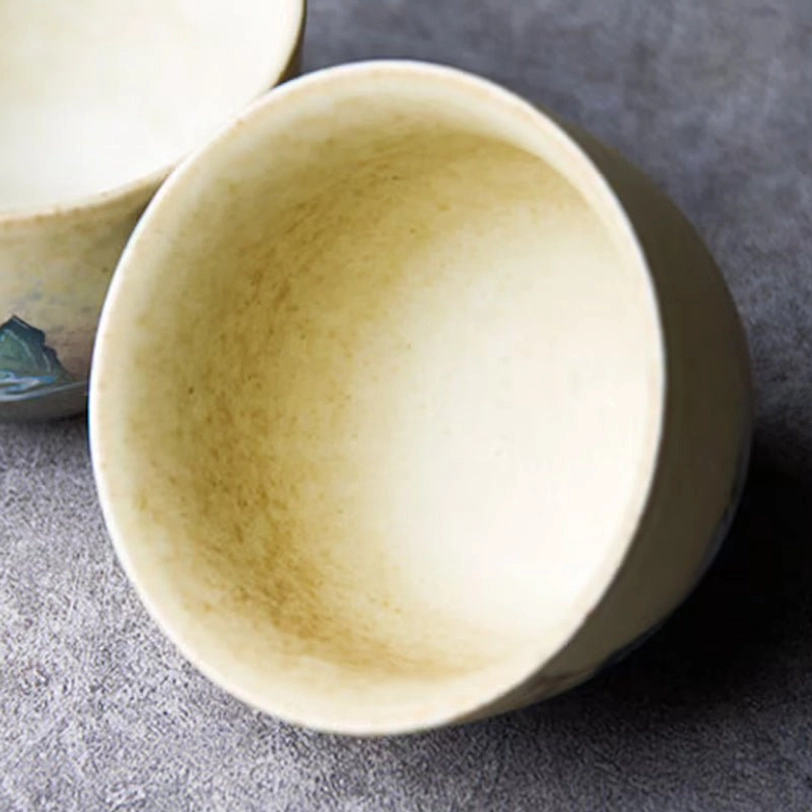 close up of traditional deer motif on ceramic tea cup