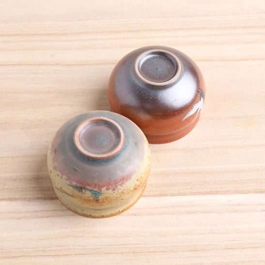 close-up of hand-painted crane motif on chinese ceramic tea cup