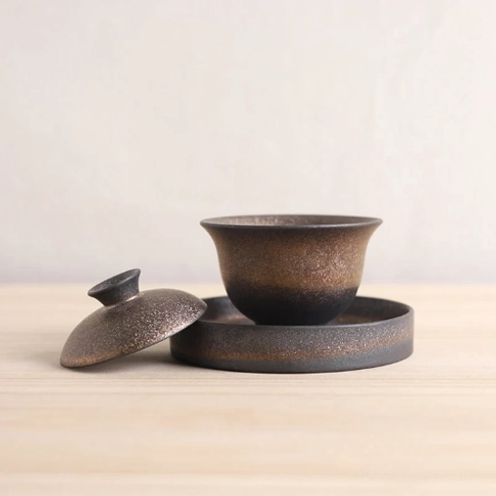 close up of gradient metallic glaze texture on gaiwan lid