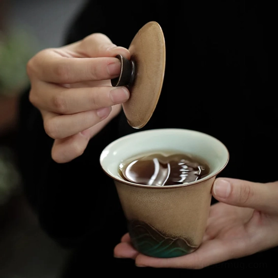 close up of mountain design ceramic gaiwan tea cup lid and bowl
