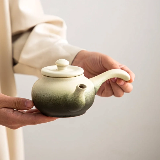 close-up of side handle on matte gradient ceramic kyusu teapot