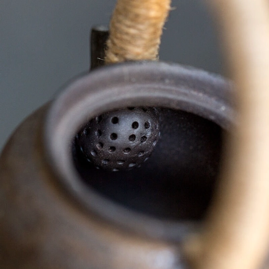close up of spout on blue gourd ceramic teapot