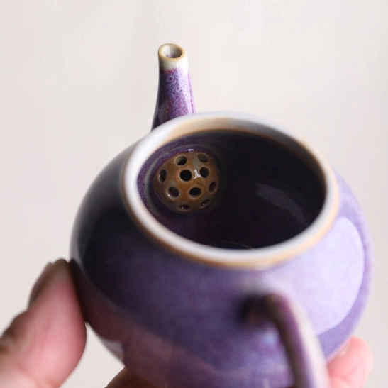 Close up of spout for drip-free pouring on 110ml teapot with infuser