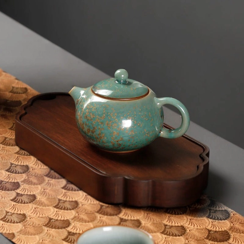 close up of spout of the green ceramic gongfu teapot