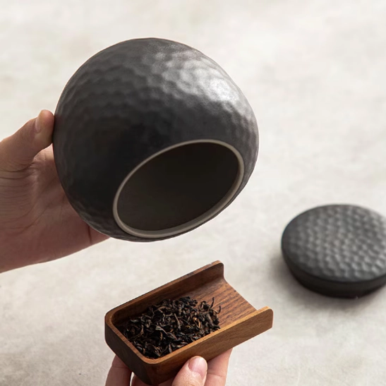 Close up of silicone seal inside black ceramic tea storage canister lid