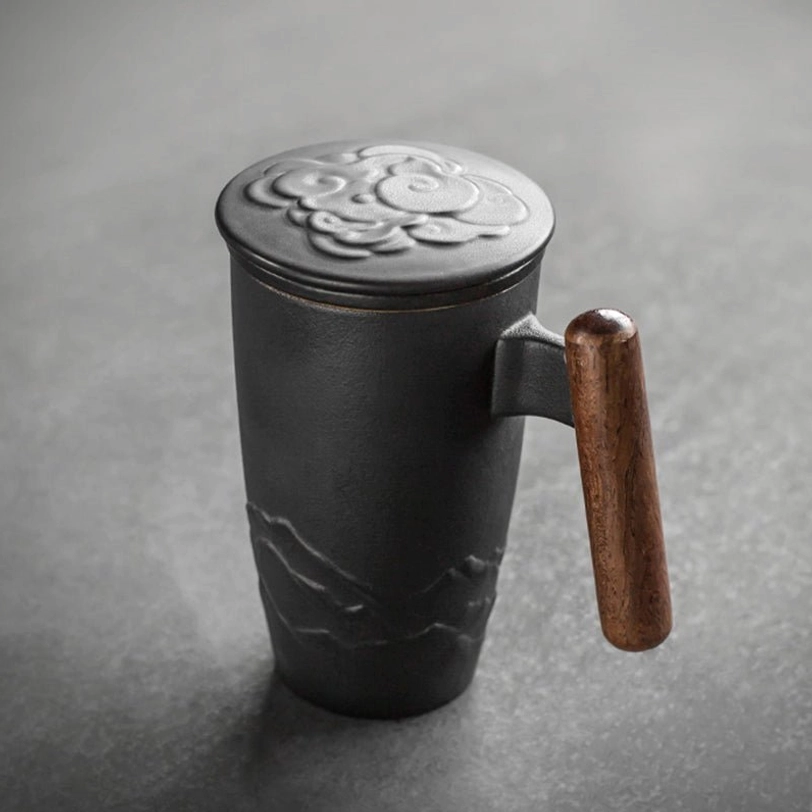 close up of embossed cloud carving on tea infuser mug lid
