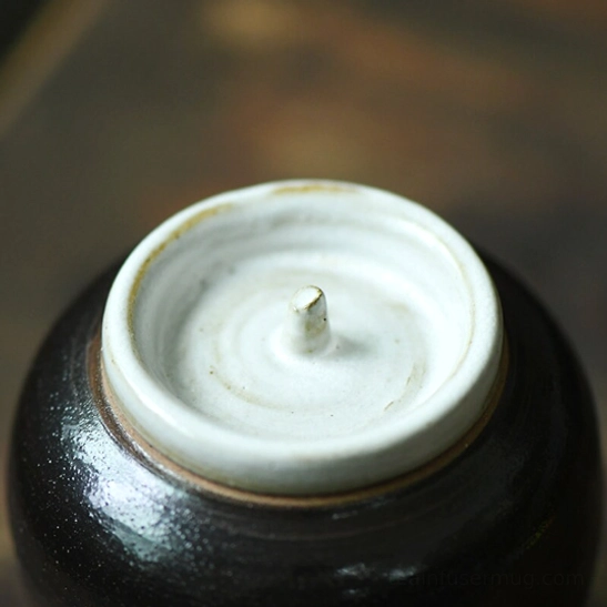 Side angle view of compact 200ml ceramic loose leaf tea storage canister