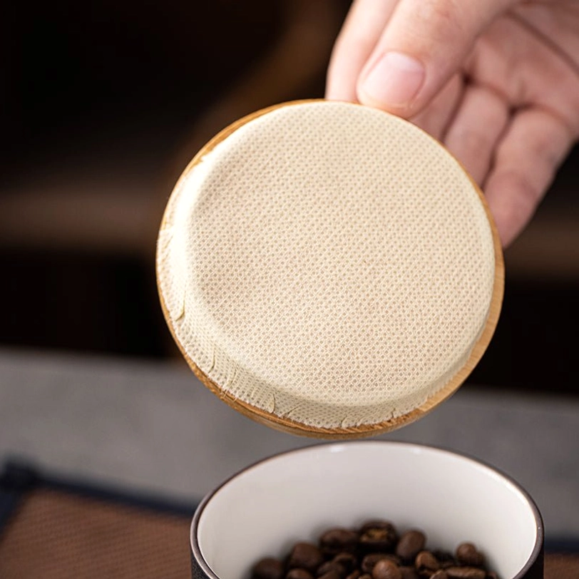 handheld view of compact portable ceramic tea storage canister