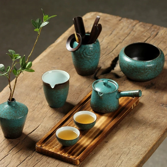crackle glaze kyusu teapot on tea table with matching tea accessories