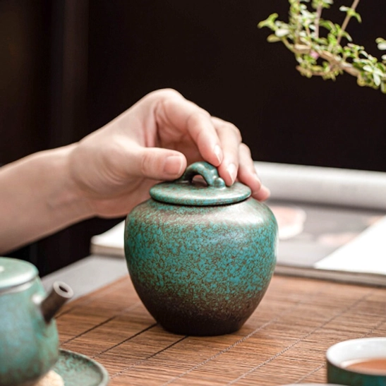 curved lid handle on 300ml gradient ceramic tea canister