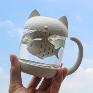 Full front view of cute cat shaped glass tea mug with fish infuser