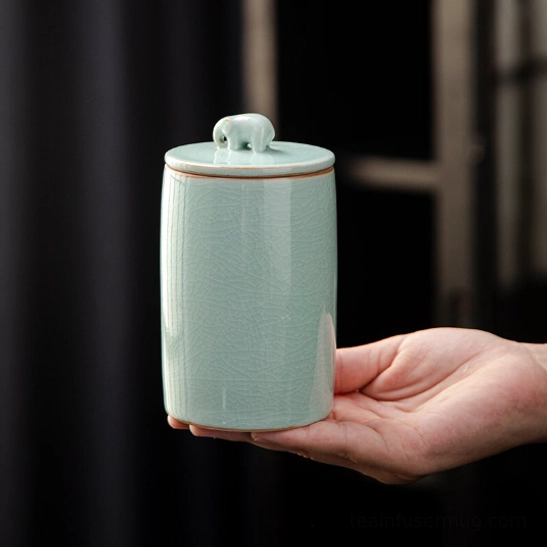 Cyan crackle glaze ceramic tea storage canister with elephant handle