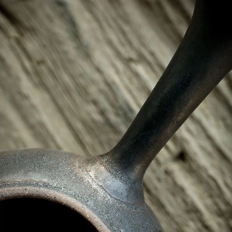 bottom base of the dark ceramic kyusu teapot