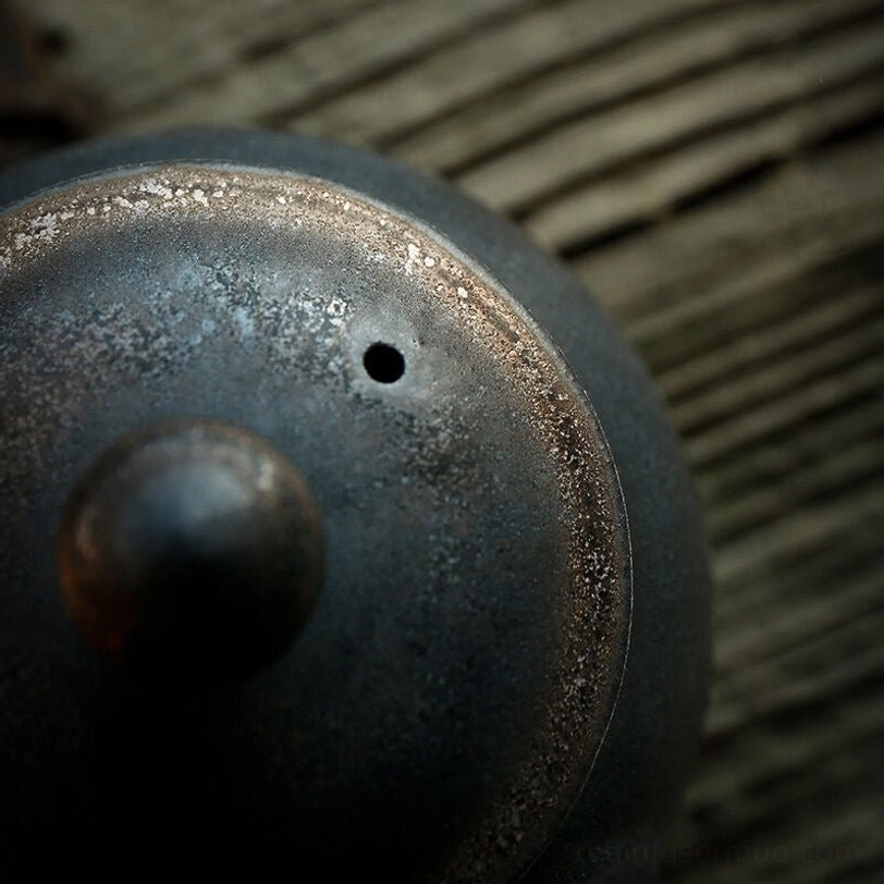 top view of dark kyusu teapot showing lid and knob