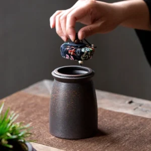 airtight dark ceramic tea storage canister with blue fabric drawstring lid