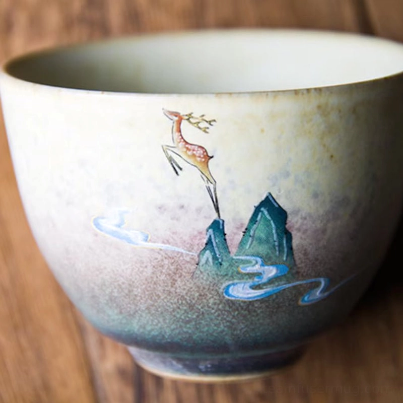deer motif chinese tea cup on natural wood background