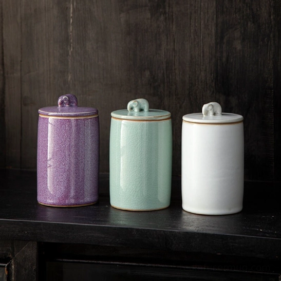 Airtight ceramic tea storage canister with elephant handle front view