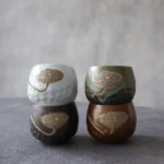 side profile of embossed lotus porcelain chinese tea cup