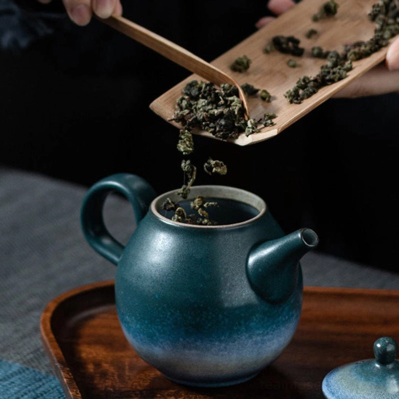 ergonomic handle view of 210ml starry sky mountain ceramic teapot