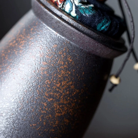 traditional patterned blue fabric drawstring lid with wooden beads for tea storage canister